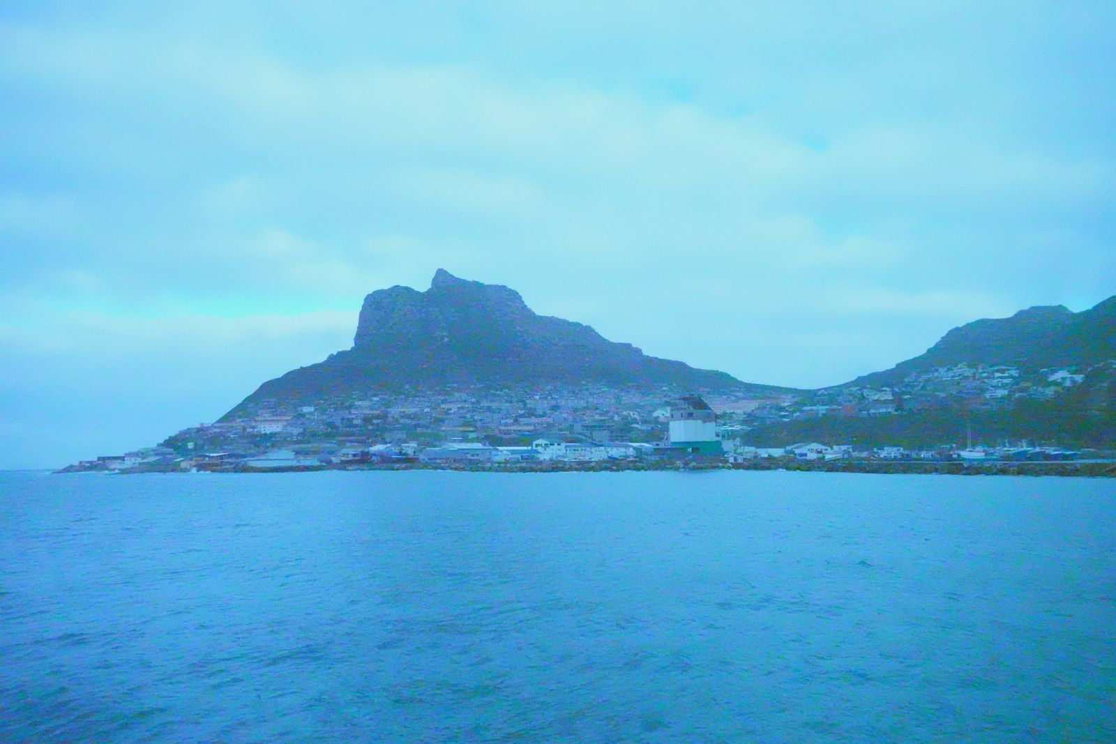 Turquoise bay beneath a mountain peak