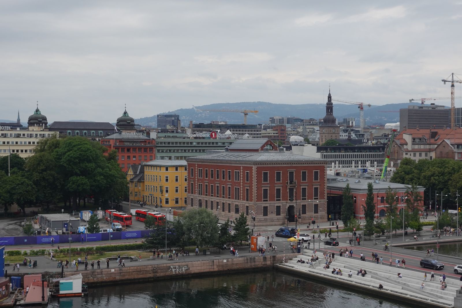 Harbour buildings along the water under a wide sky